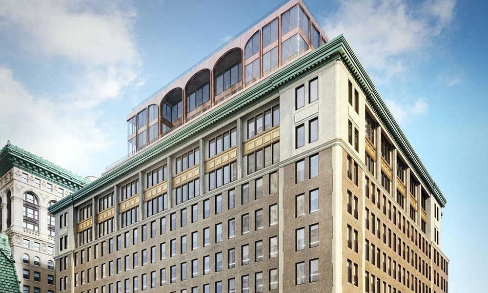Upper-half of the facade of the office at 295 Fifth Avenue in New York City.