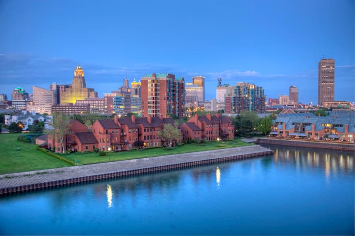 Downtown Buffalo skyline along the historic waterfront district at night.