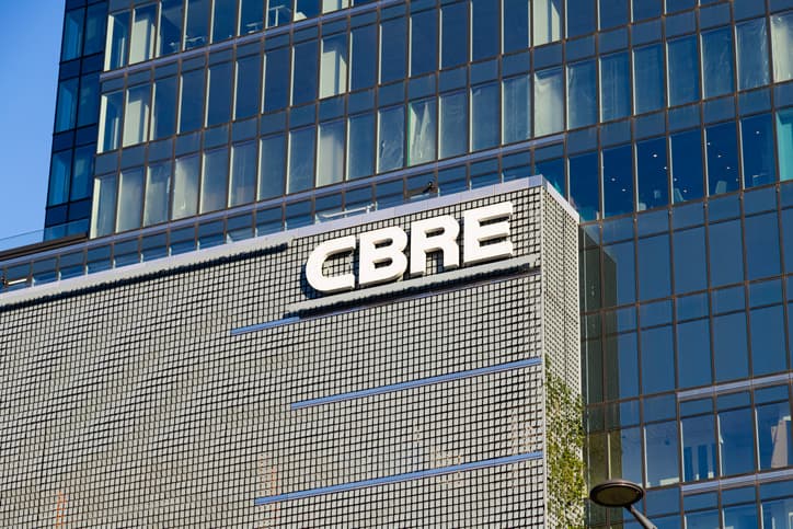 CBRE's logo spans the front of an office building.