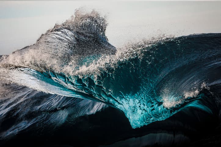 Extreme close up of thrashing ocean waves.