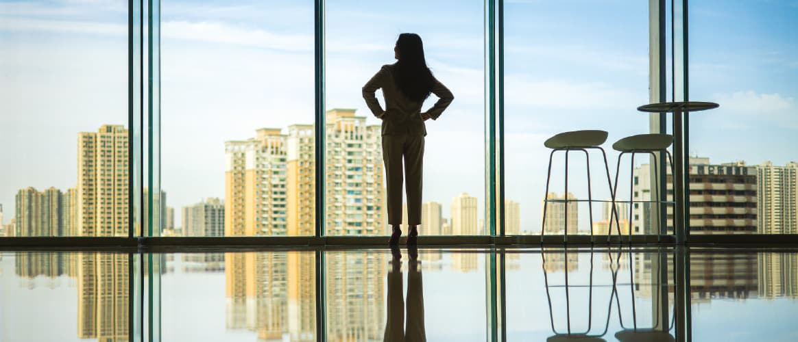 Woman standing in a window