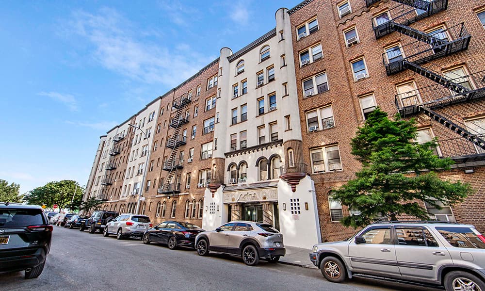 The front facade of a New York City apartment building acquired by a JV including PH Realty.