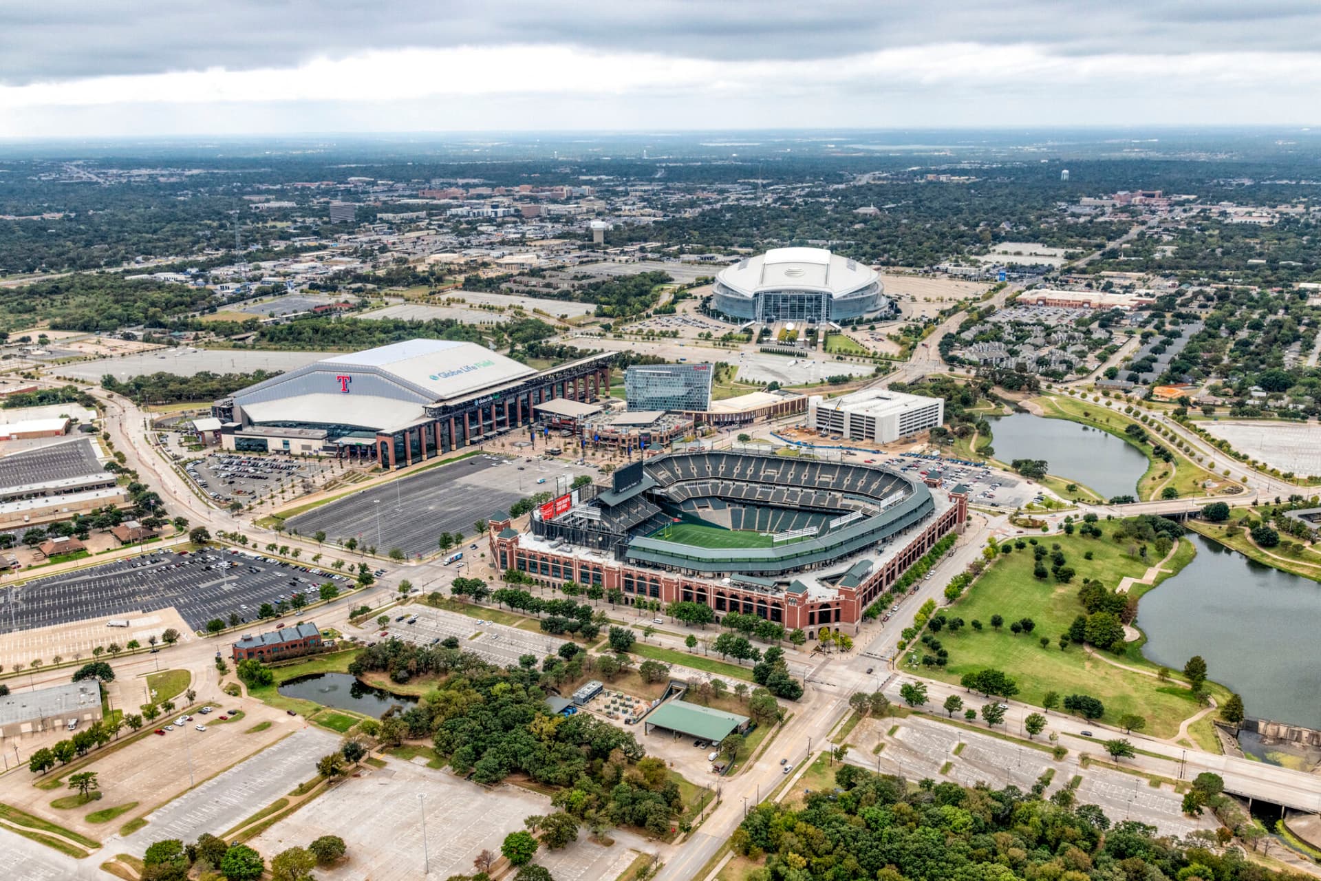 Arlington, United States - October 21, 2020: Aerial view of the three professional sports venues on adjacent properties just east of Dallas, Texas, including Globe Life Field, the former home of baseball's Texas Rangers, Globe Life Park, the new home of the Texas Rangers, and AT&amp;T Stadium, the home of the NFL Dallas Coboys.