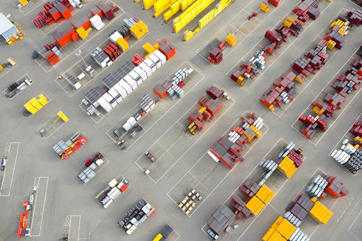 Plastic and metal ware for construction viewed from above at a depot. Industrial outdoor storage.