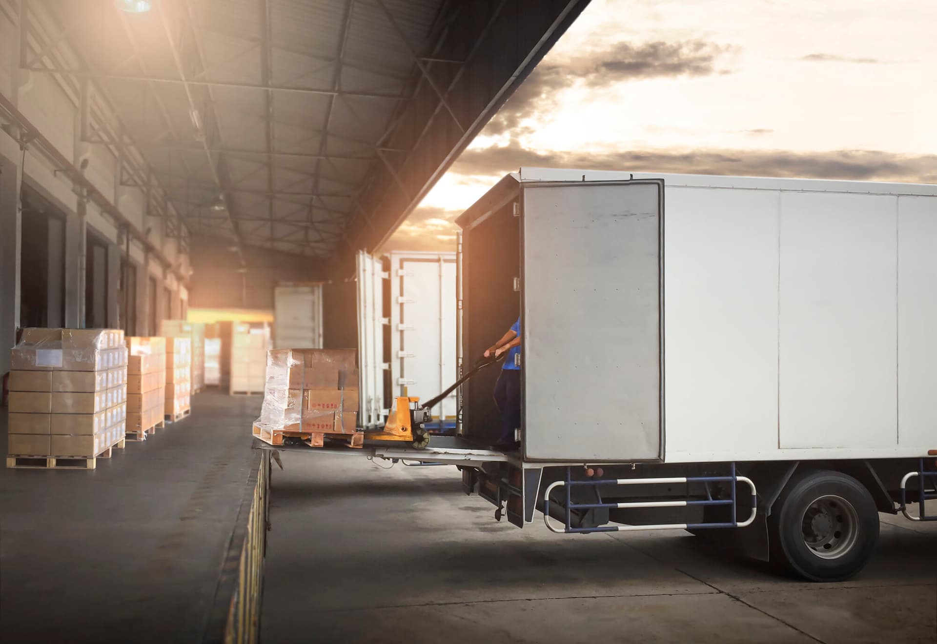 Photo of a semi-trailer truck that is ready to be loaded at a warehouse.