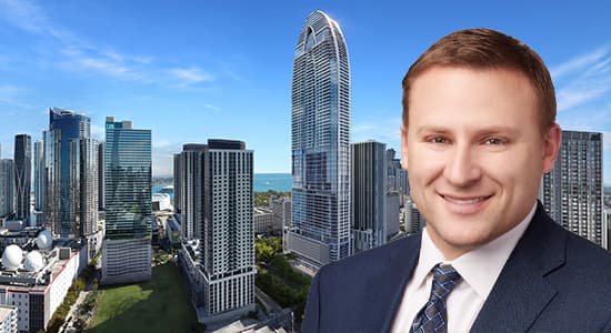 Jeff Klar, vice-president at Bayview PACE in front of a rendering of Okan Group's Okan tower in downtown Miami.
