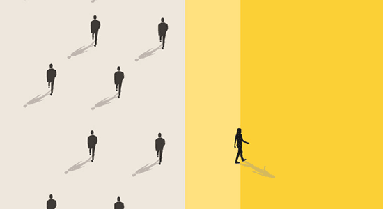 An aerial picture taken of a group of people walking, with one person walking in a different direction to the rest