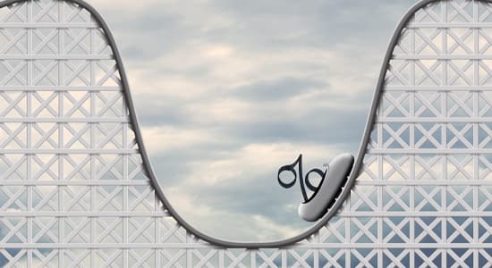 A rollercoaster with a percentage sign sat on the rollercoaster's cart