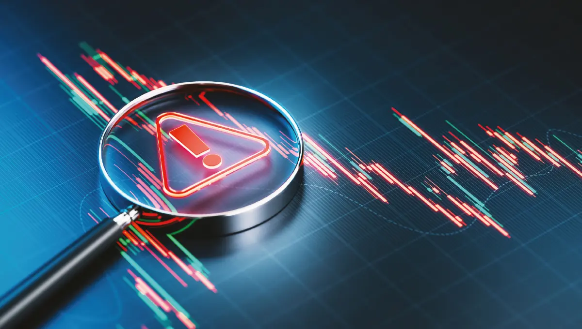 A magnifying glass over a data visualisation reveals a warning sign in red