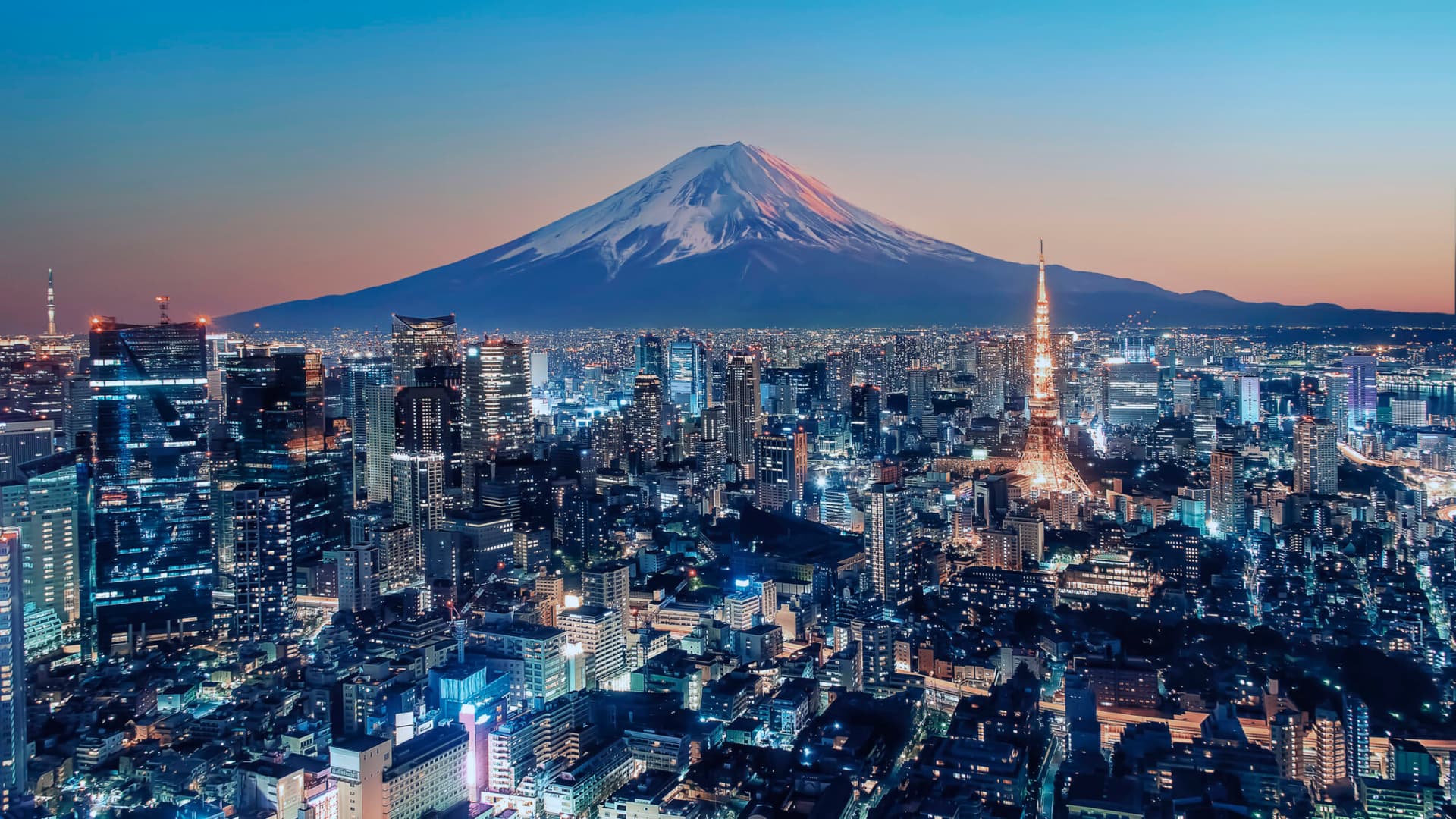 Tokyo, Japan at sunset with Mount Fuji in the background