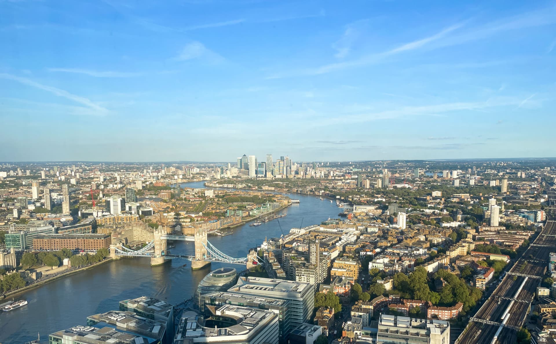 London, England, 14 September 2023: Tower Bridge, Canary Wharf and the London city skyline seen from high up.