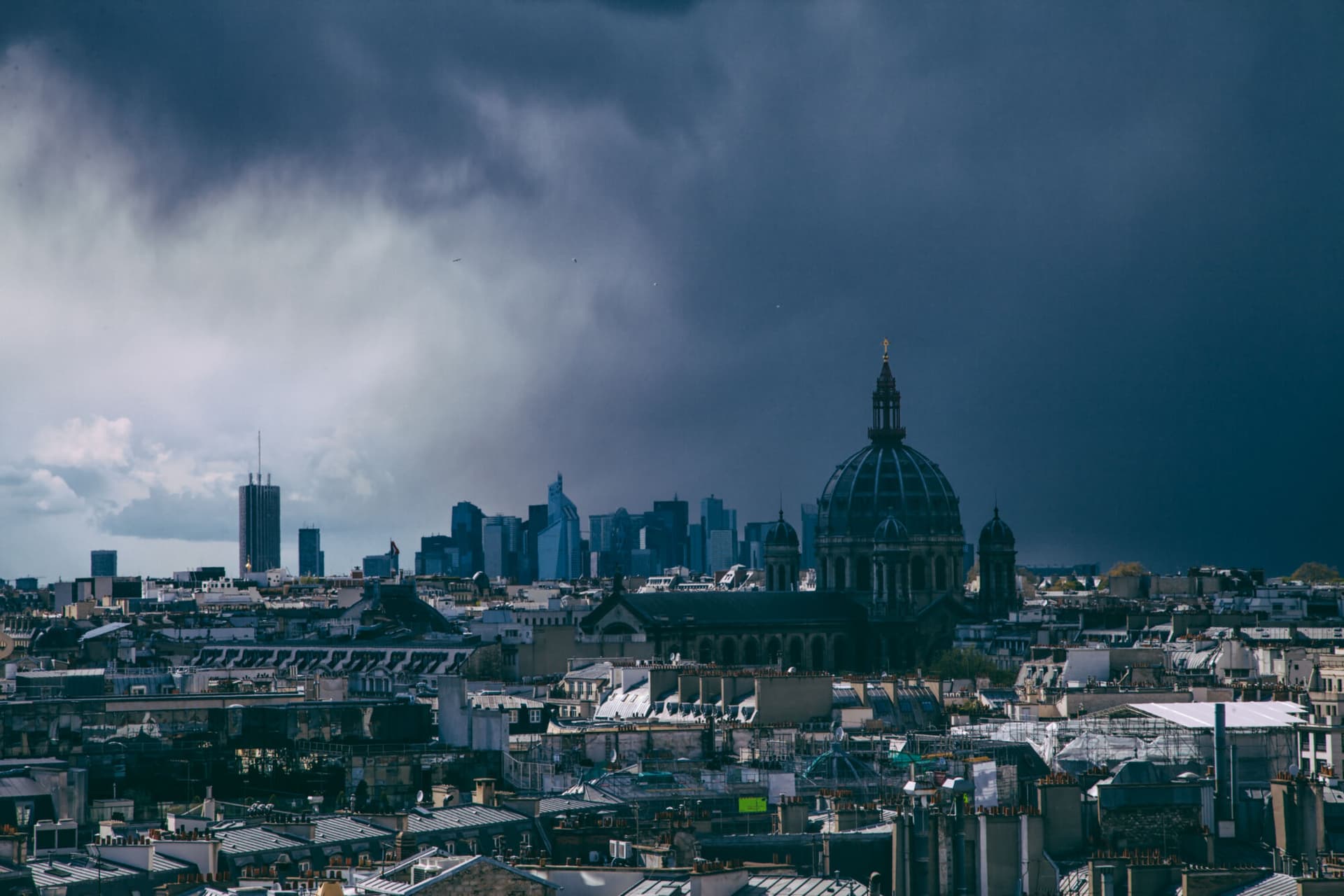 Paris aerial view St. Augustin and La Defence background on cloudy and stormy weather in Paris, France