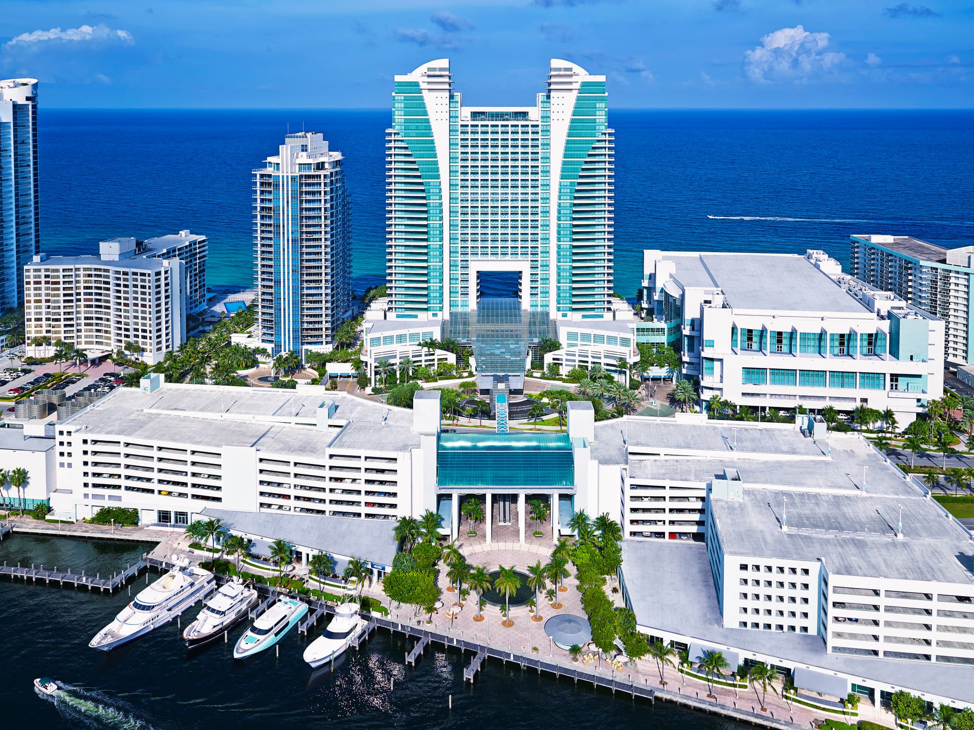 The Diplomat Hotel, surrounded by buildings and water