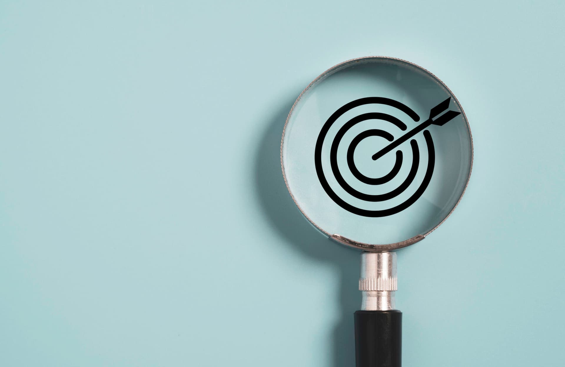 Target board inside of magnifier glass for focus business objective