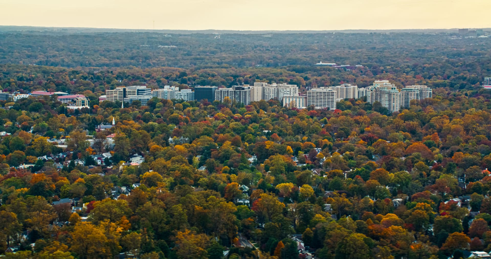 Helicopter shot of Chevy Chase, Maryland, the northwestern suburbs of Washington, DC, on a hazy afternoon in Fall.