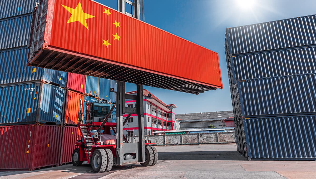 Image of a product container with the China flag on it in a shipping cargo port.
