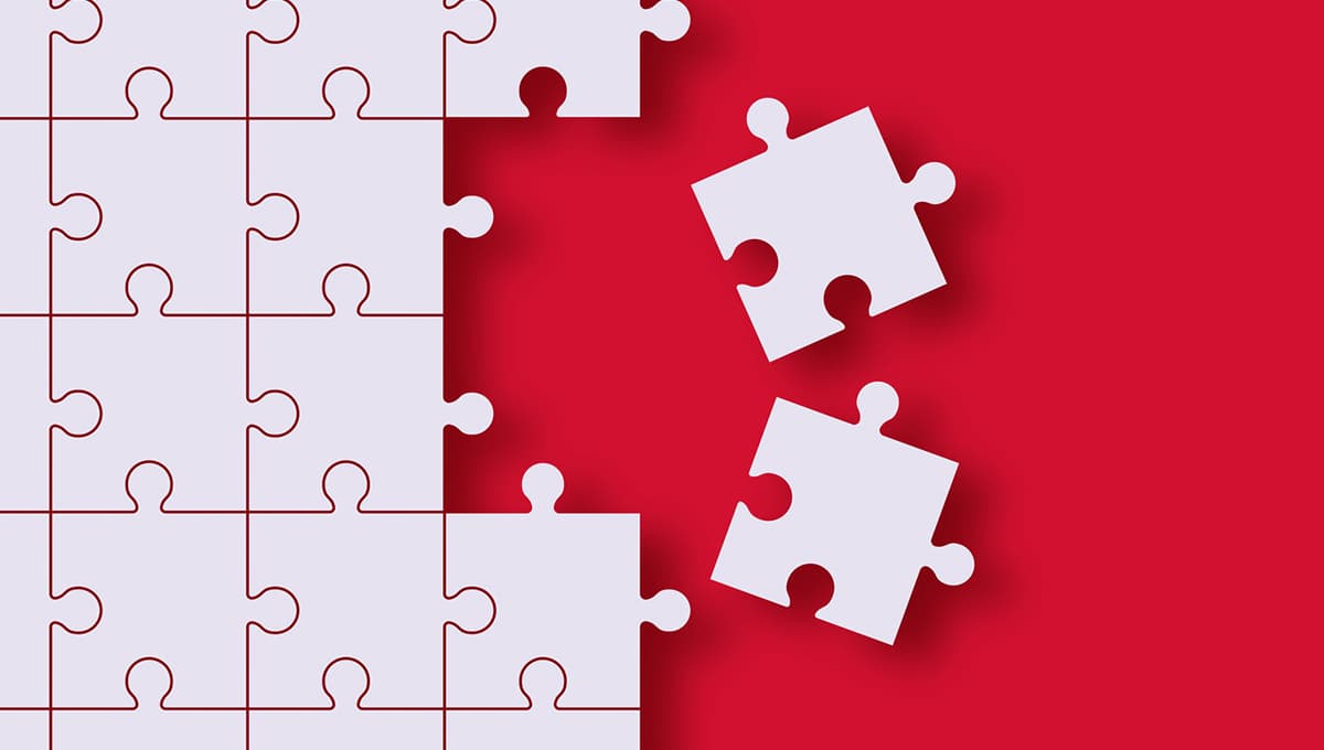 Two pieces of a jigsaw are removed from the rest of the jigsaw