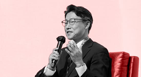 Kyle Lee speaking into a mic